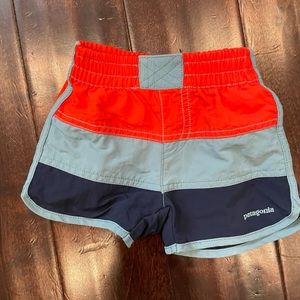 Patagonia swim trunks size 12-18m. Excellent condition.